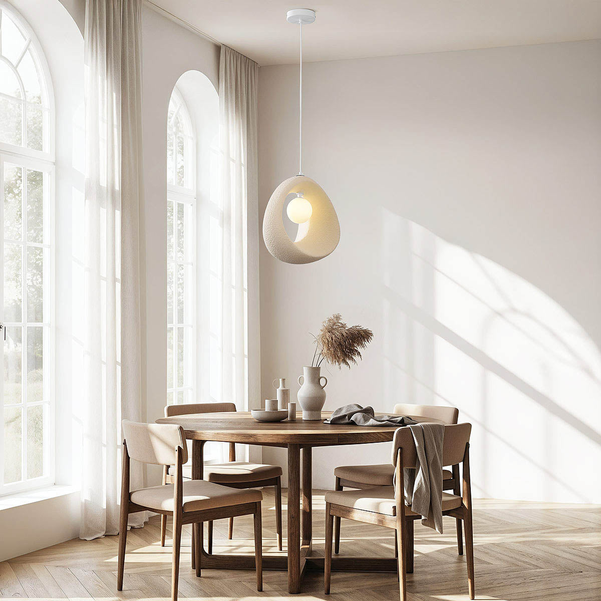 Close-up of Akari compact pendant light shade showing textured stone finish in sand beige