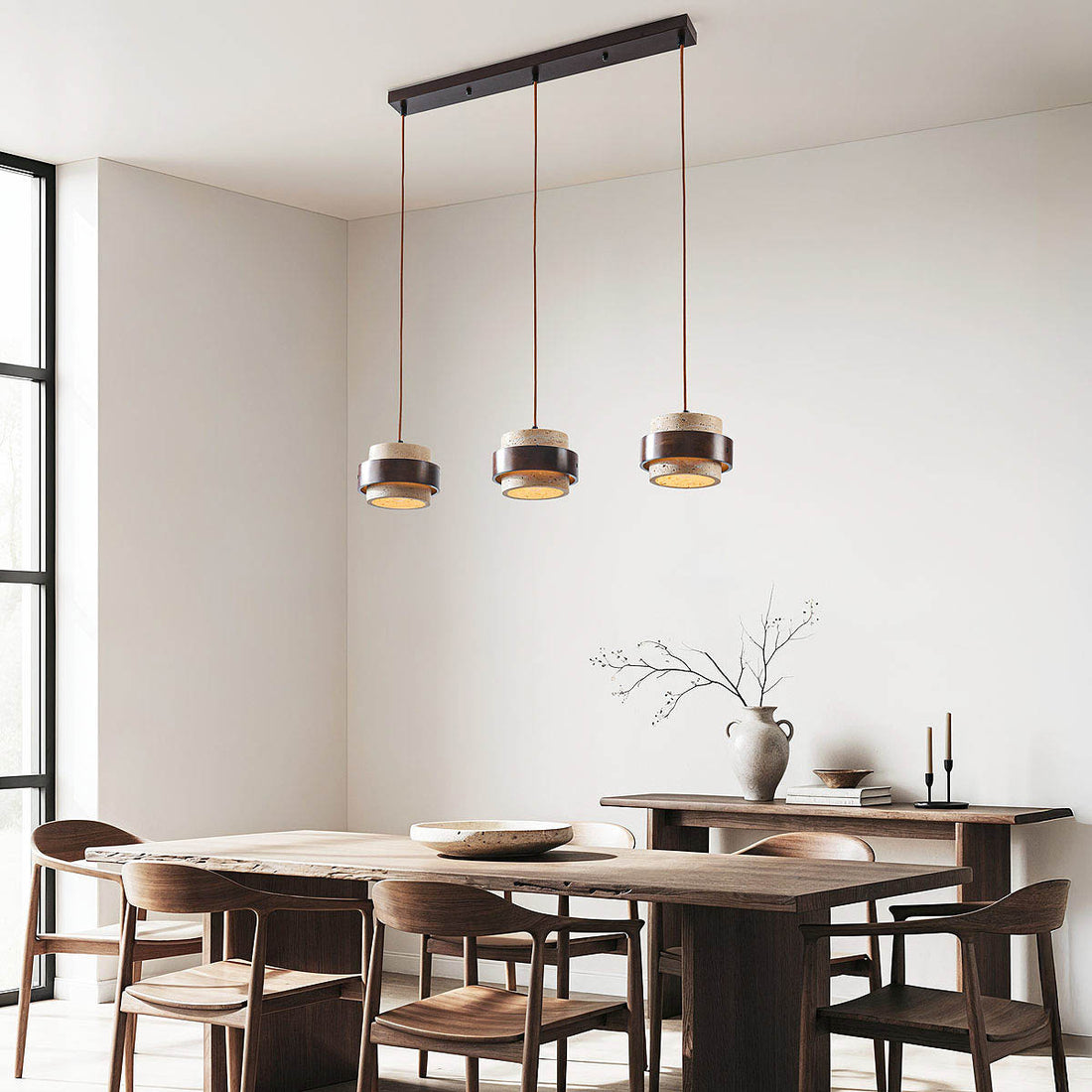 Close up of travertine stone and dark wood detail on Tsumi pendant light fixture