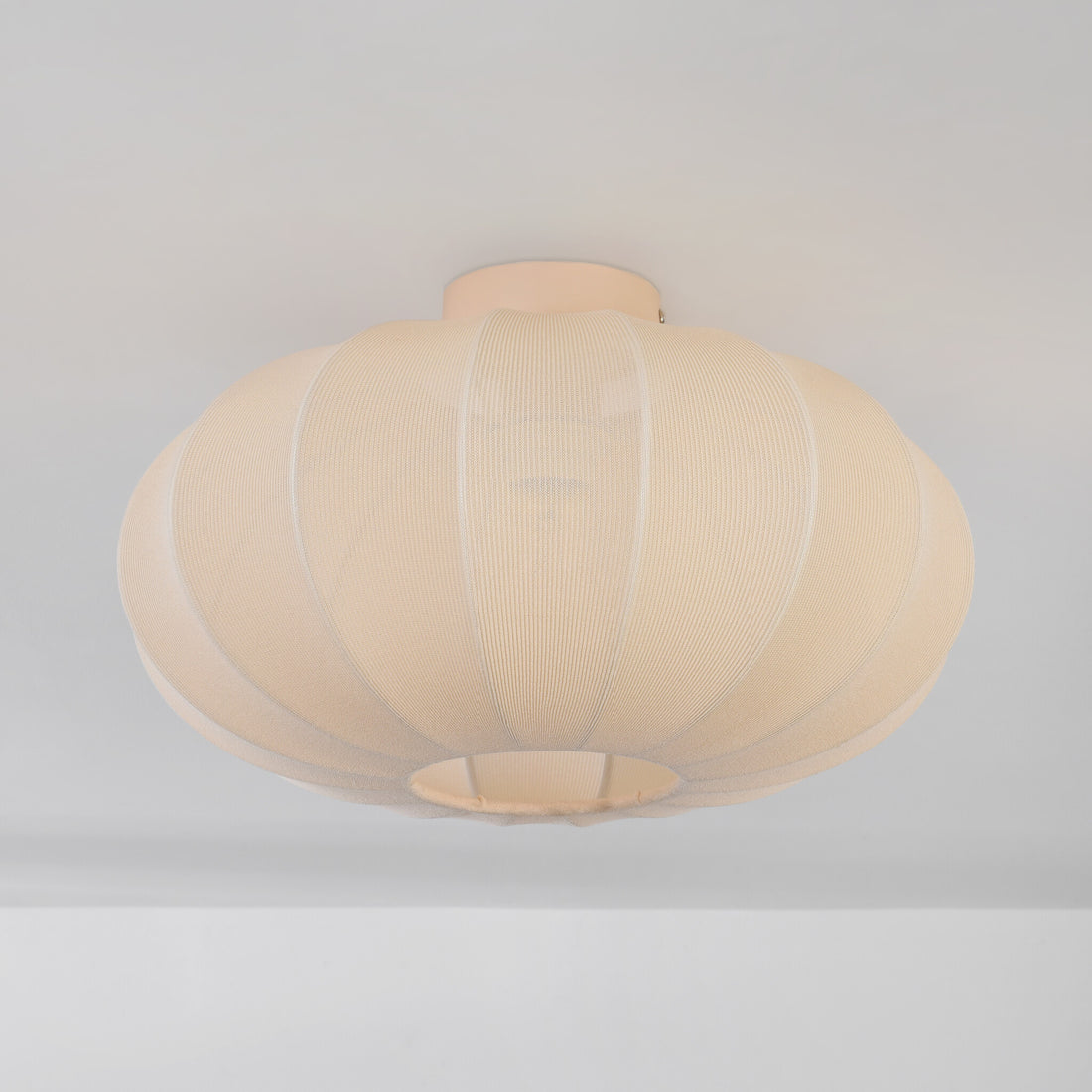 Close-up of Aya ceiling light soft beige fabric shade texture