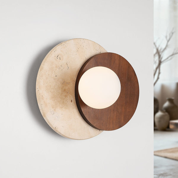 Yori sand beige travertine and dark wood circular wall light mounted on white wall