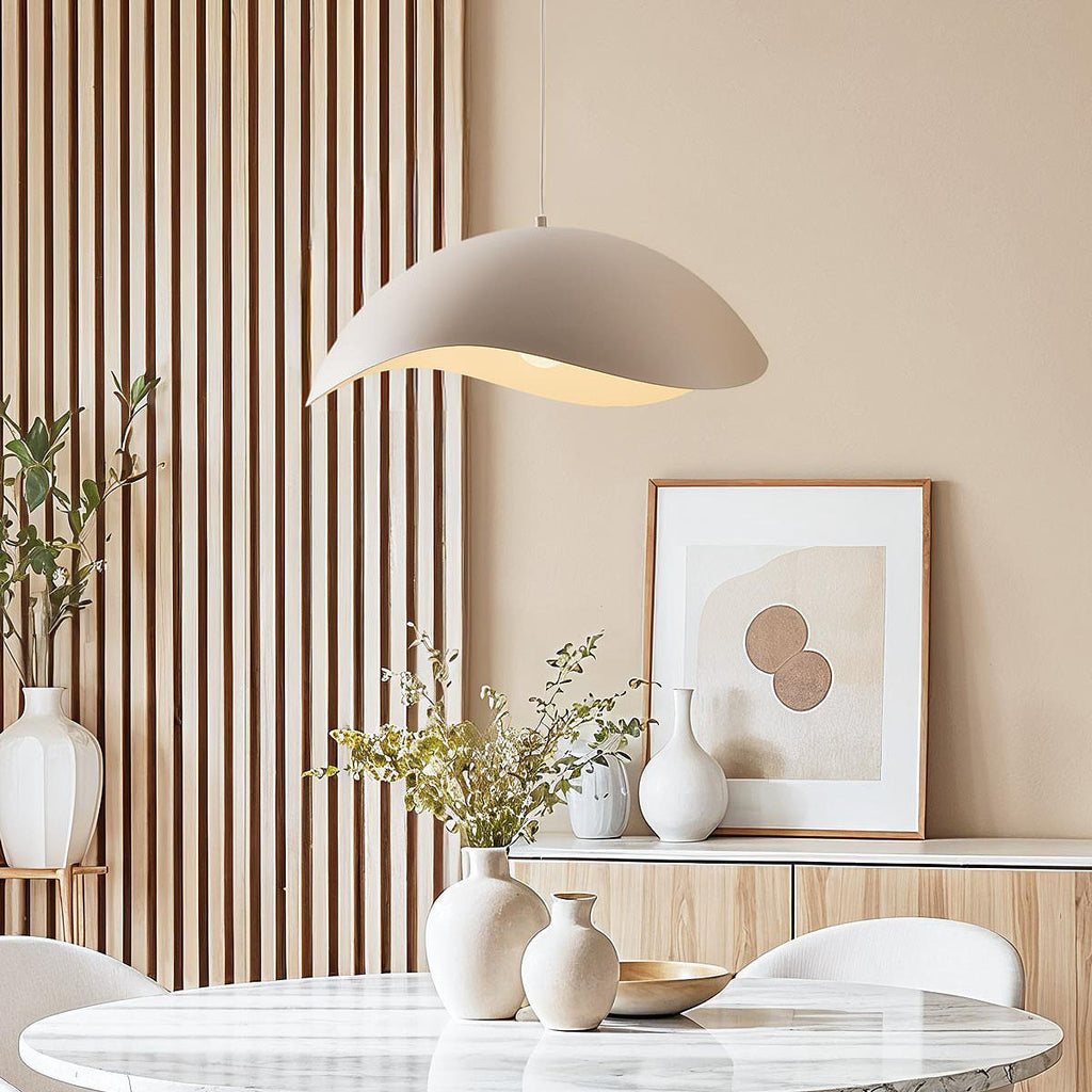 Nami wavy metal pendant light in sand taupe hanging from ceiling