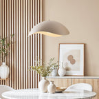 Nami wavy metal pendant light in sand taupe hanging from ceiling