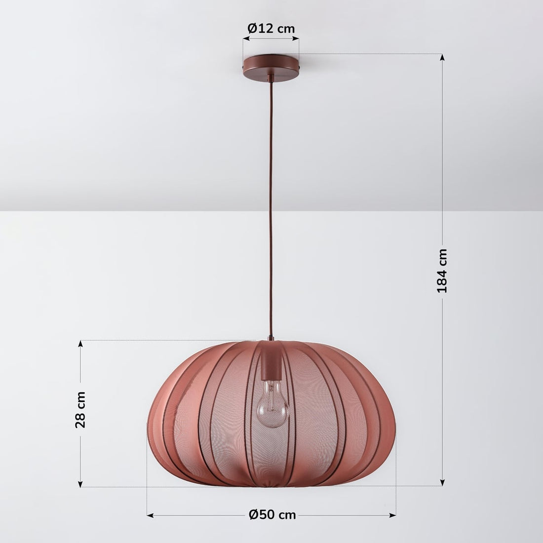 Amaro pink pendant light illuminated in modern living room setting