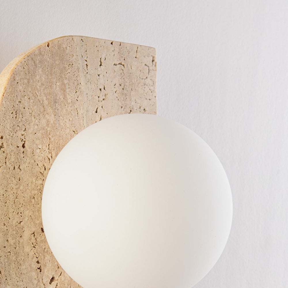Orla Travertine Globe Wall Light — Single in a room