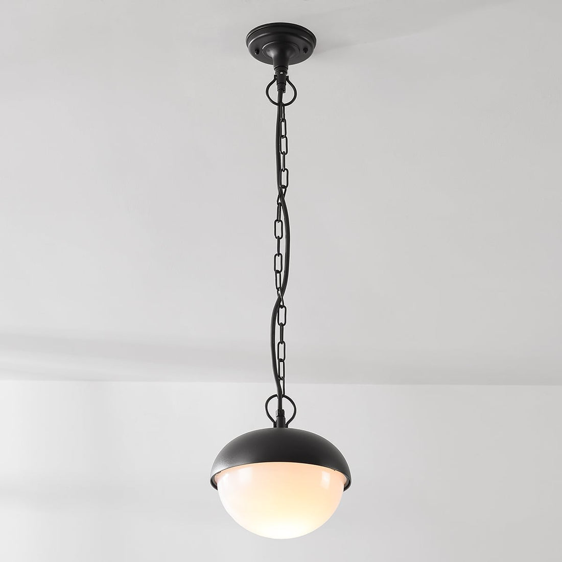 Dale black outdoor pendant light shown in covered porch setting