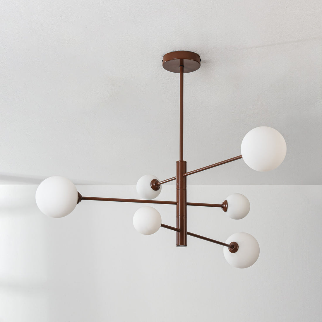 Sesto brown and white ceiling light illuminated in modern interior