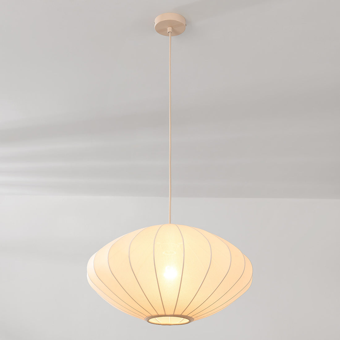Nell 48cm drum pendant light illuminated showing soft diffused glow