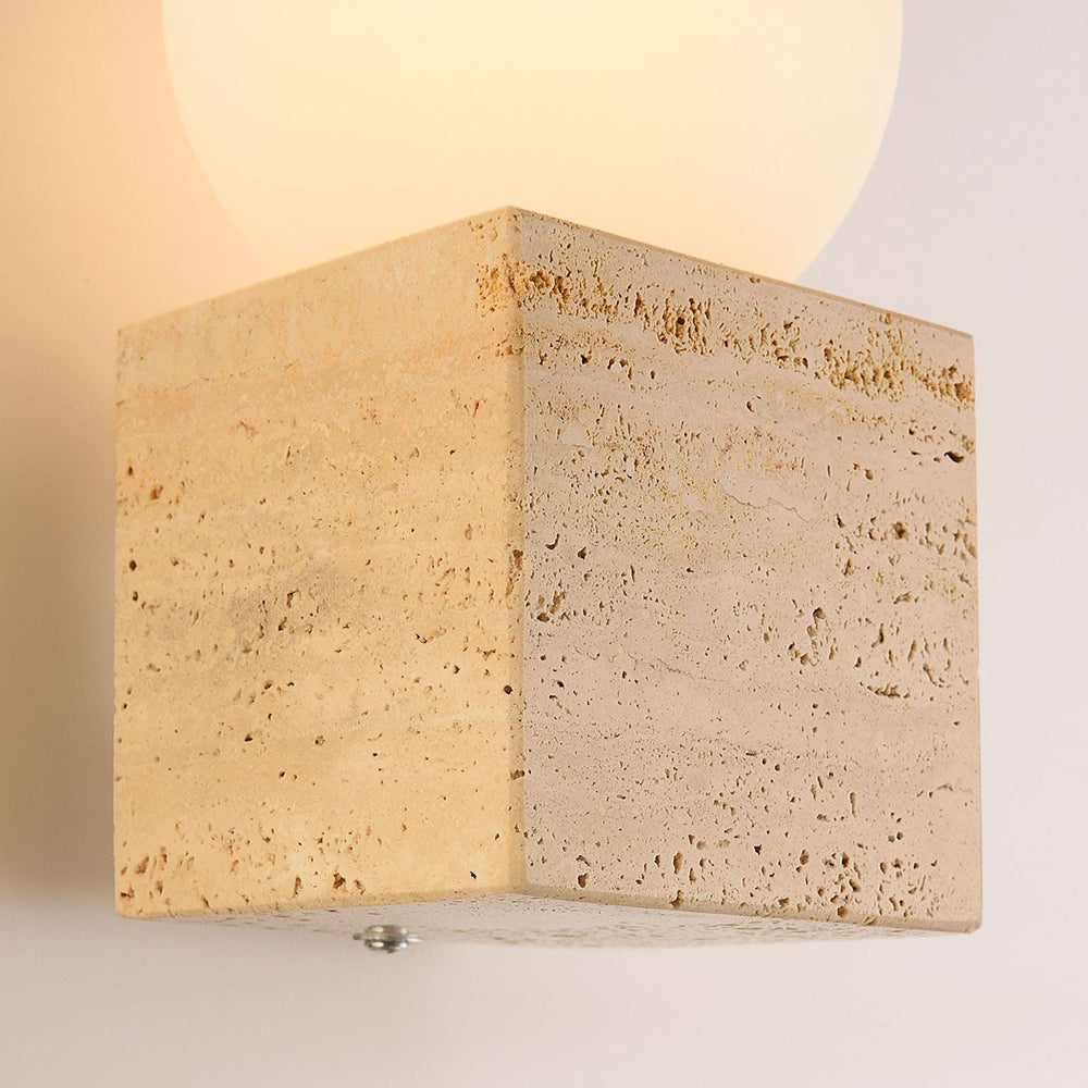Isla Travertine Globe Wall Light — Sand Beige after dark