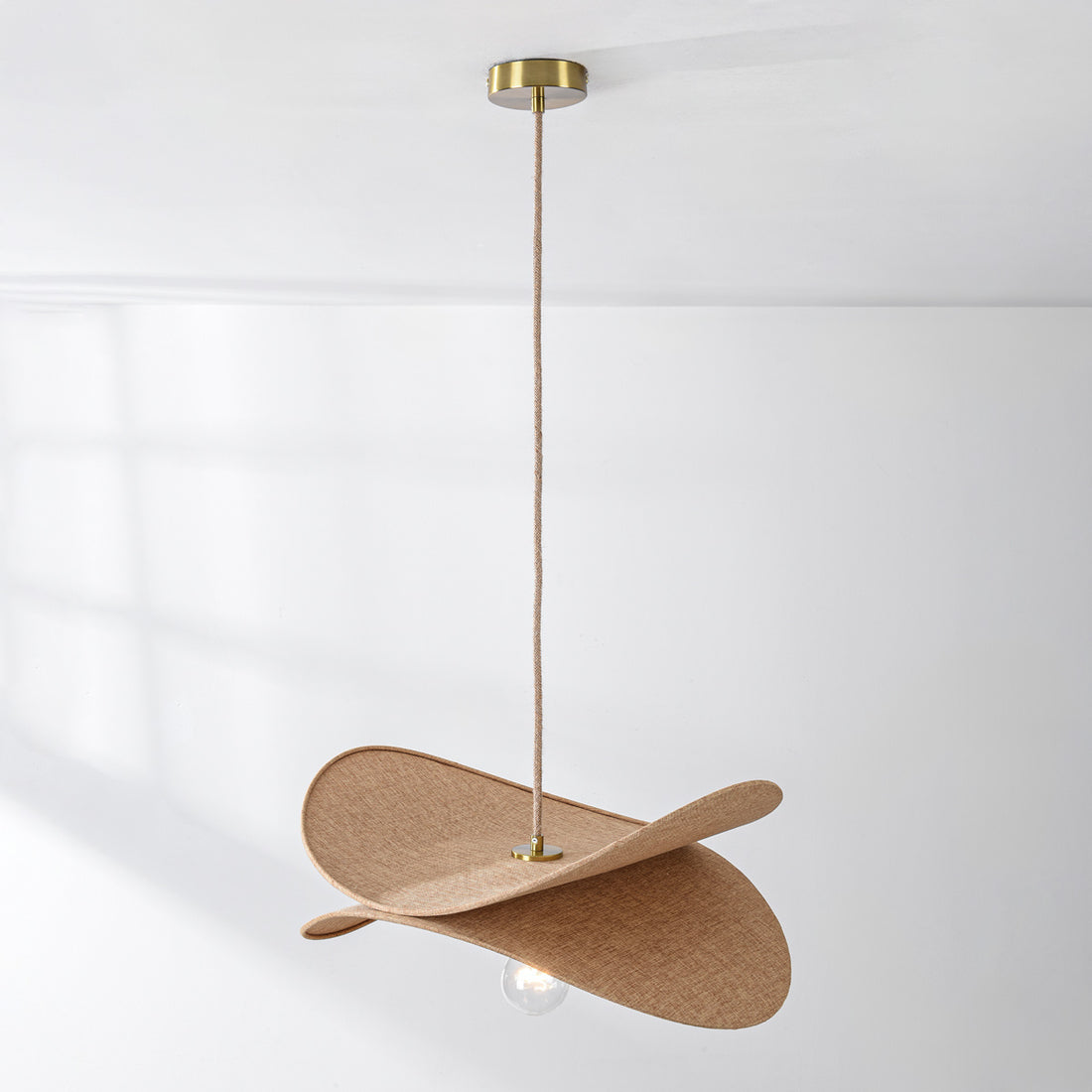 Beige linen pendant light fixture detail showing natural fabric texture and craftsmanship