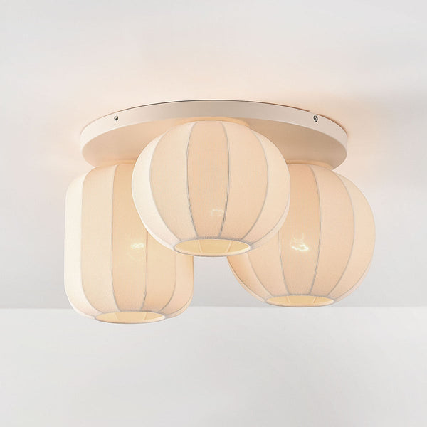 Hana beige fabric ceiling light with three shades in linear arrangement