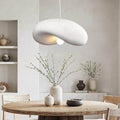 Kaia white curved stone-effect pendant light 60cm hanging above dining table