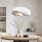 Kaia white curved stone-effect pendant light 60cm hanging above dining table