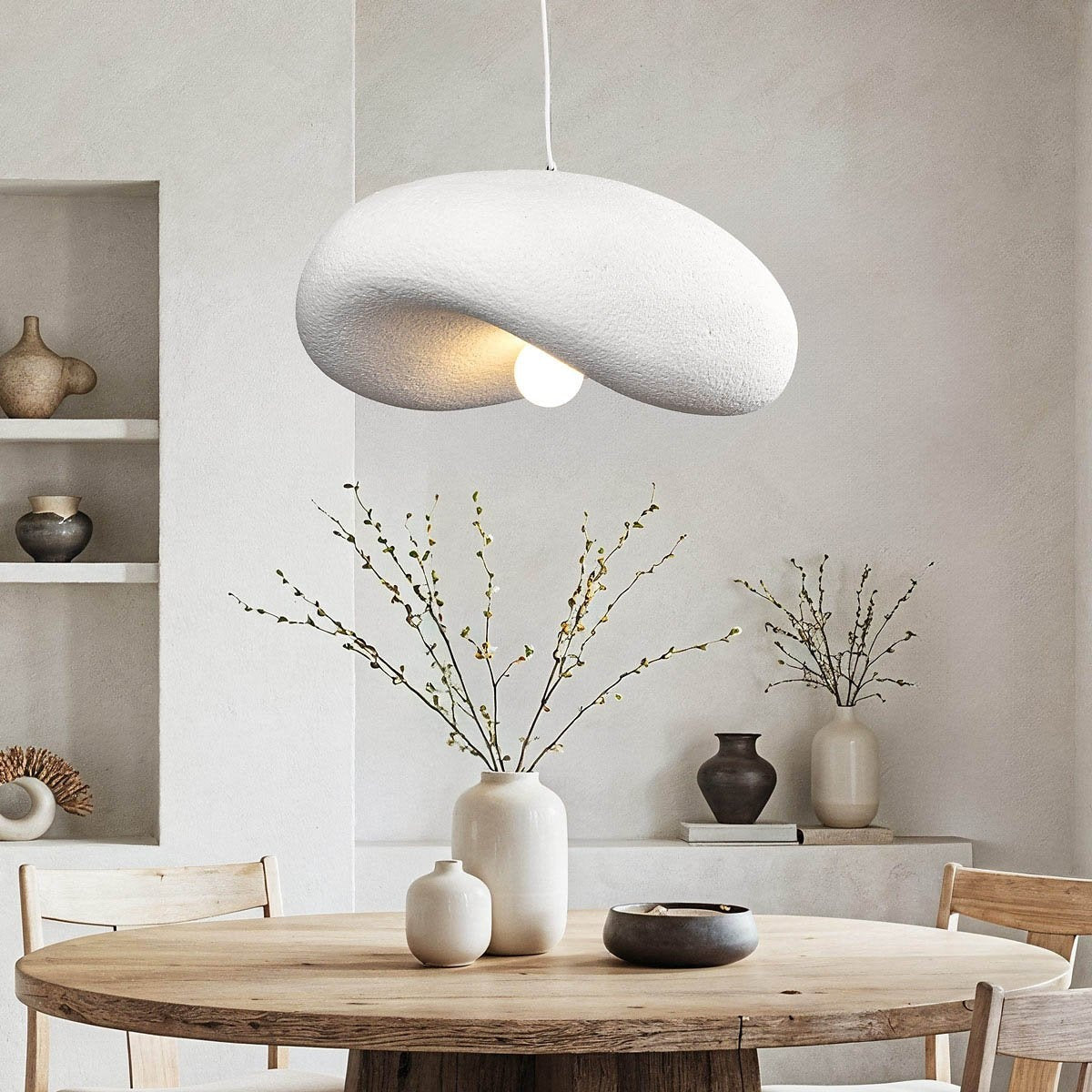 Kaia white curved stone-effect pendant light 60cm hanging above dining table