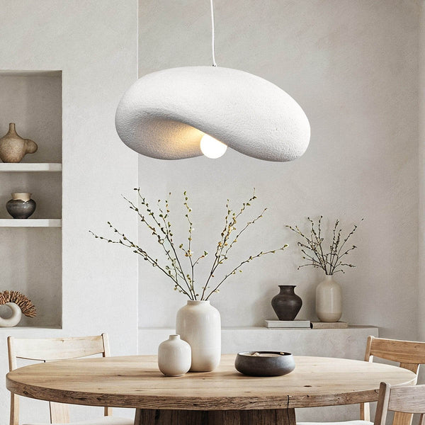 Kaia white curved stone-effect pendant light 60cm hanging above dining table