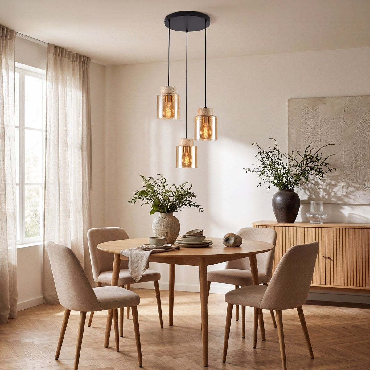 Close up of travertine and brass fixture on Akiko amber glass pendant light
