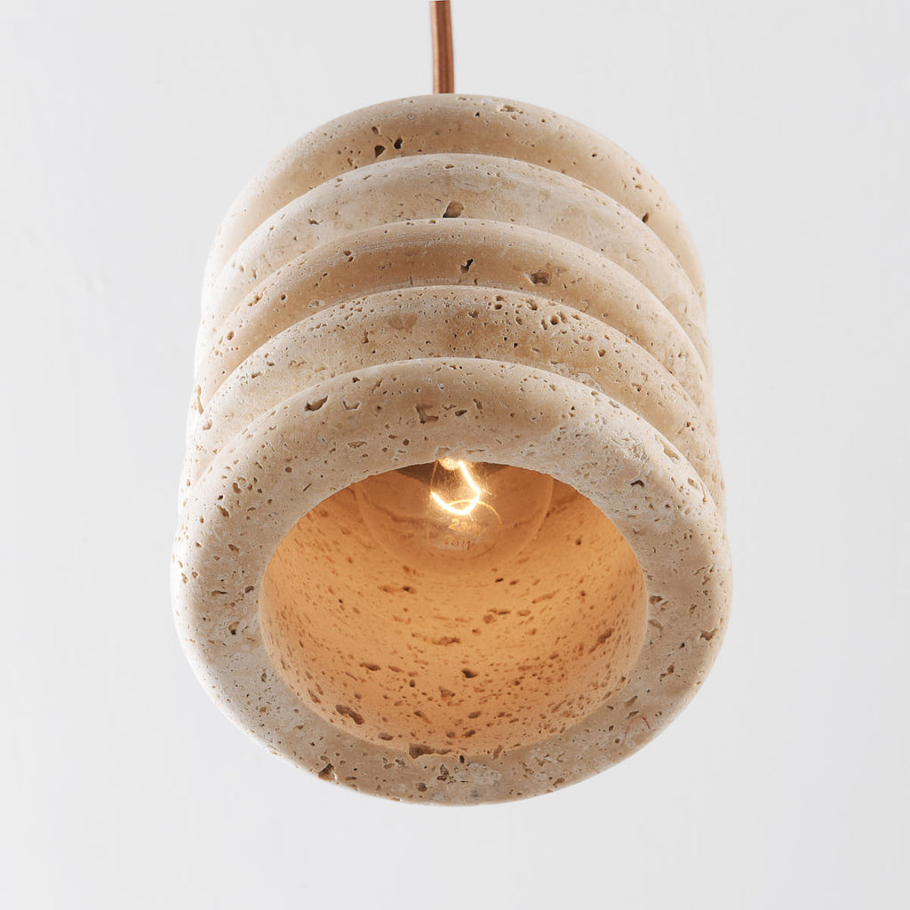 Kyoto cylindrical pendant light in beige showing travertine texture detail