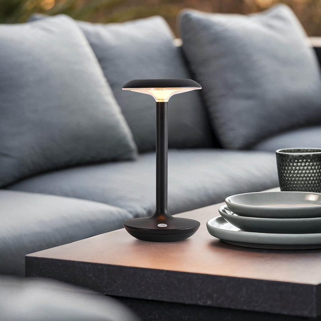 Three black portable table lamps arranged in living room interior