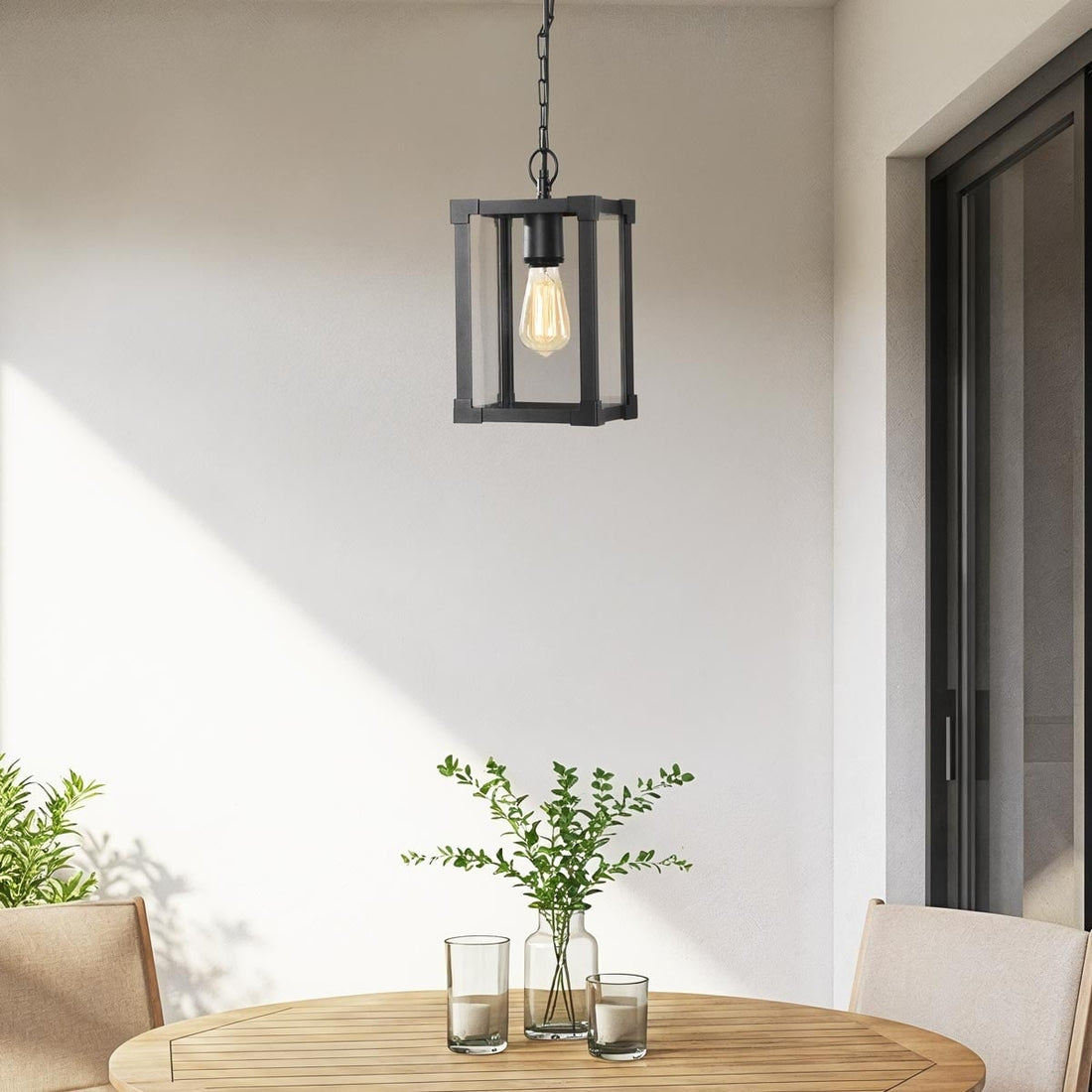 Holt black industrial outdoor pendant light with glass panels hanging from ceiling