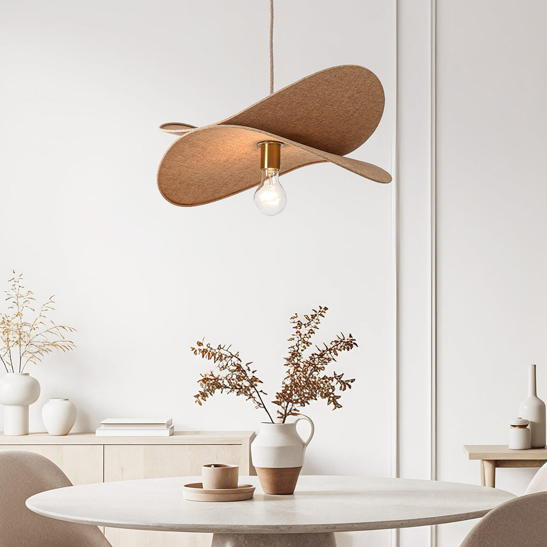 Hemi beige linen pendant light hanging over dining table in modern UK home