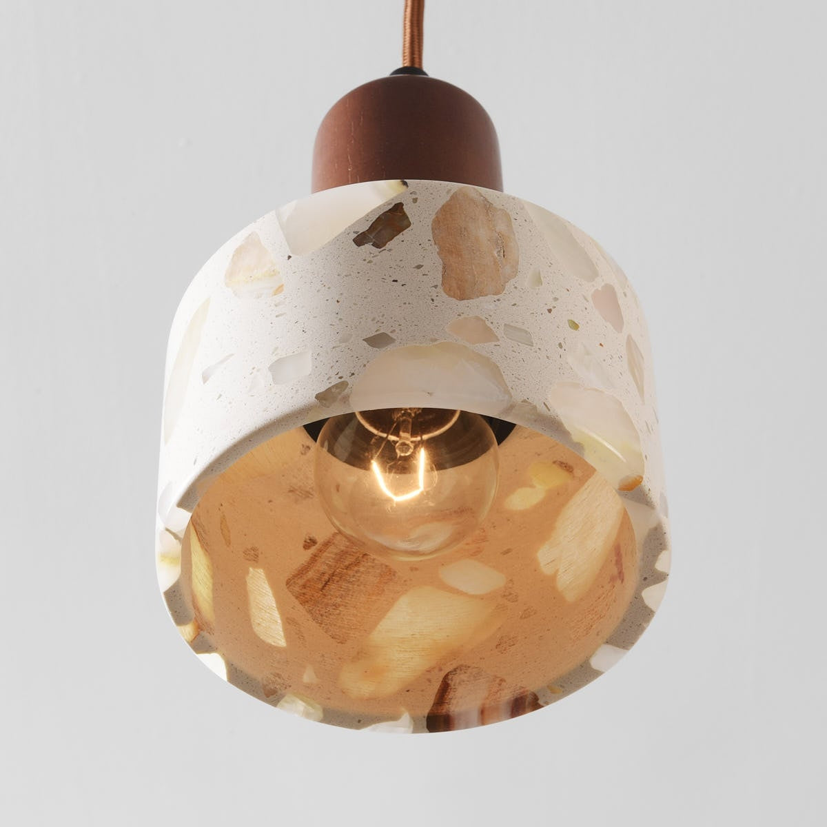 Koto pendant light illuminated showing translucent glowing shade effect