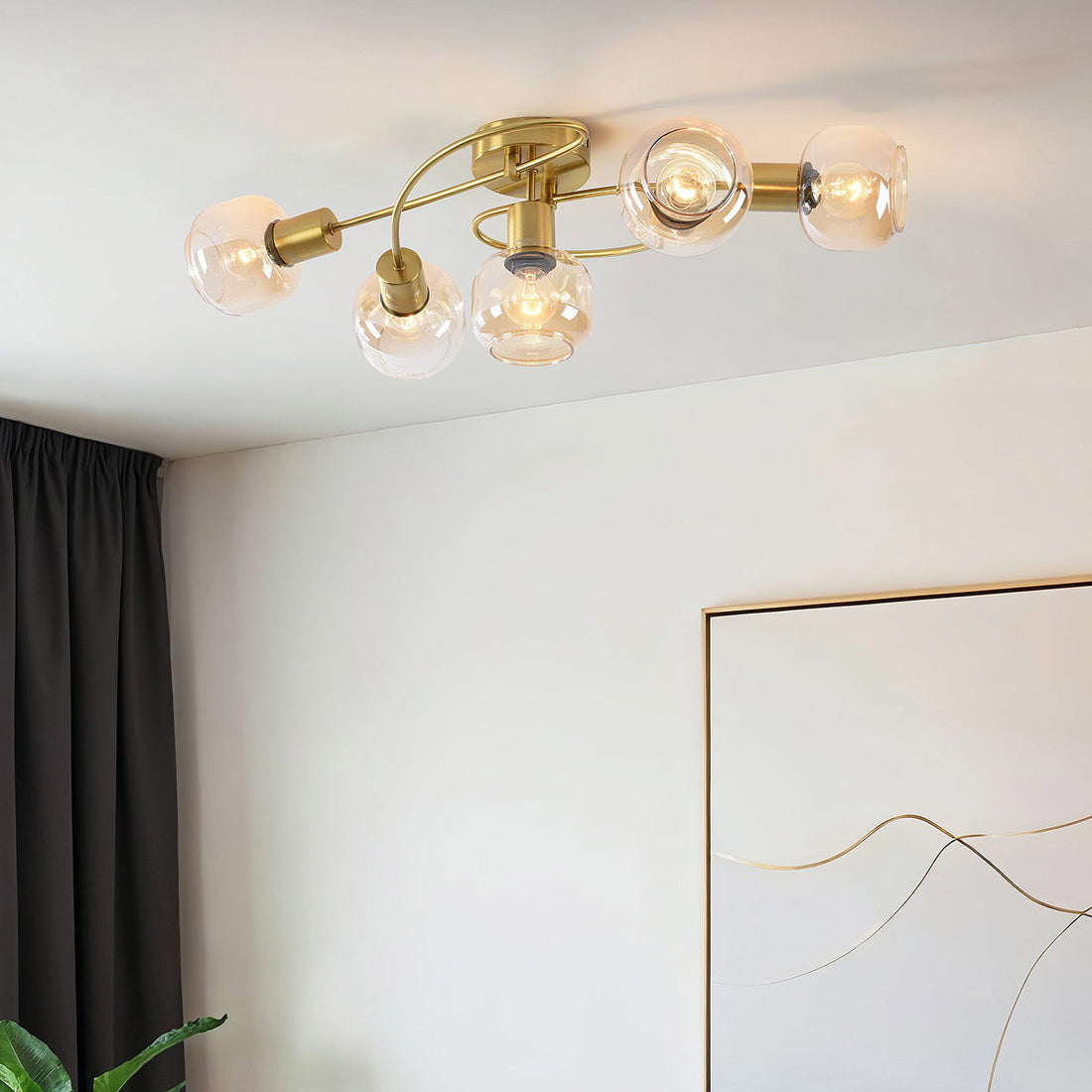 Aurum five-light gold ceiling light with amber glass globes