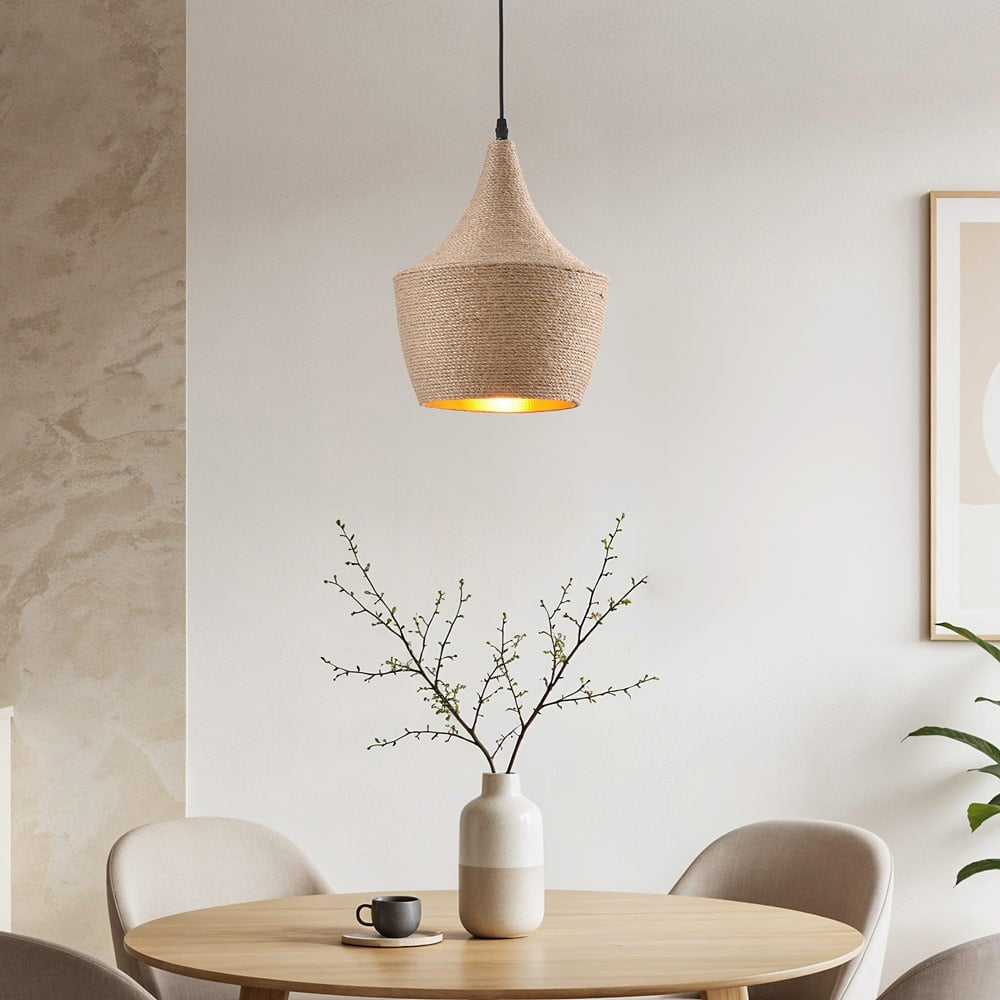 Corda natural hemp rope pendant light with gold interior suspended from ceiling
