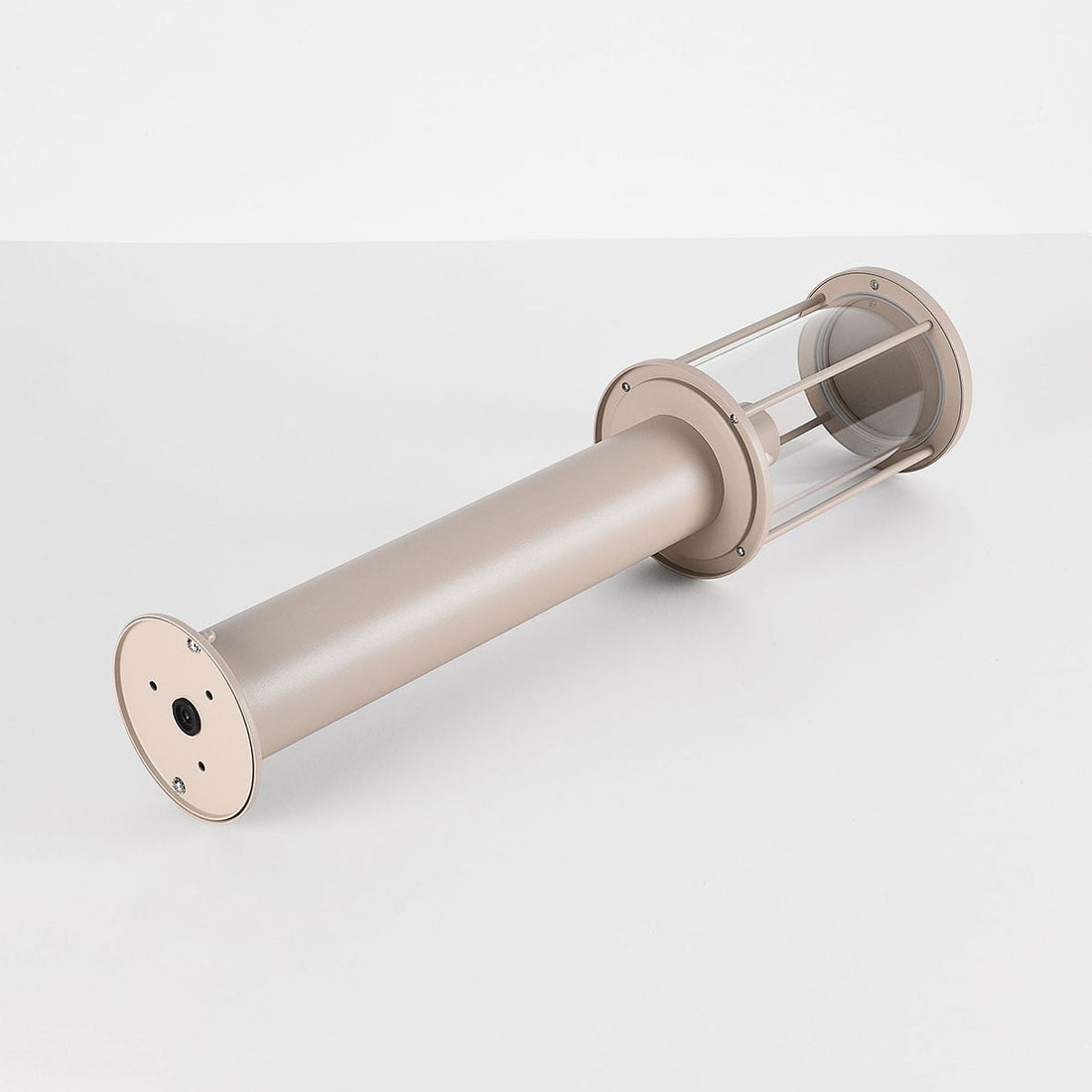 Dune 60cm outdoor path light illuminated at dusk in modern garden setting