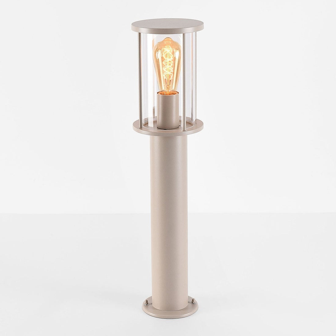 Close-up of Dune garden post light showing beige column and clear glass shade
