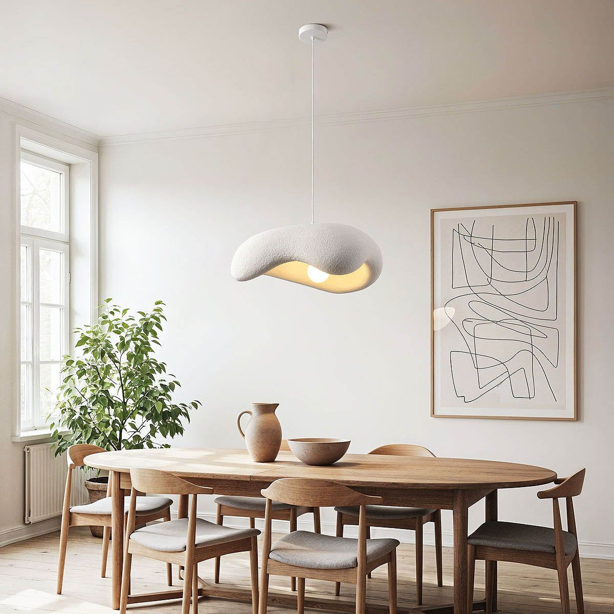 Close-up of Kintsu matt white pendant light showing elongated river stone shape