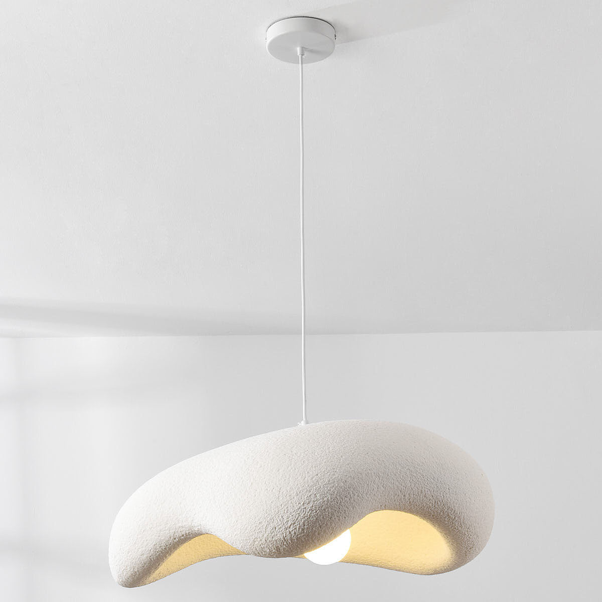 Kintsu white pendant light illuminated showing downward light diffusion