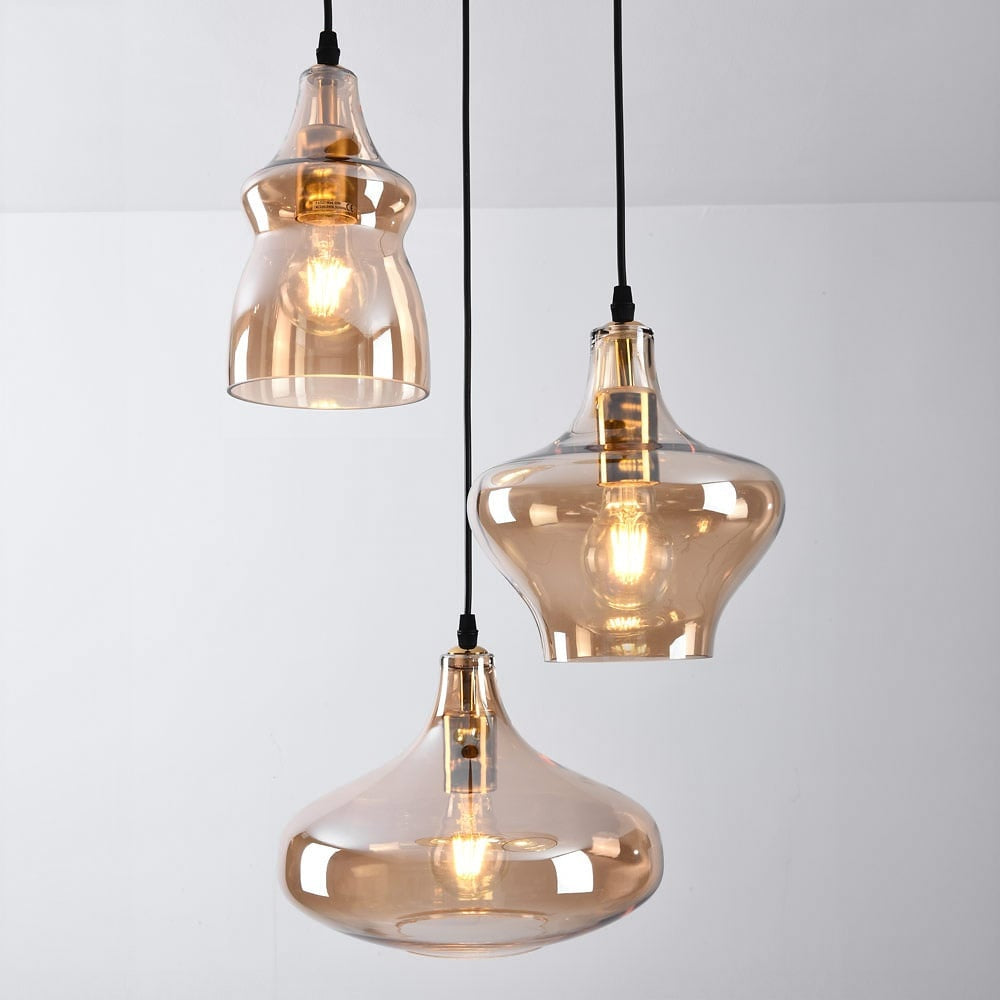 Brixton industrial triple pendant light with black metal frame and amber glass shades