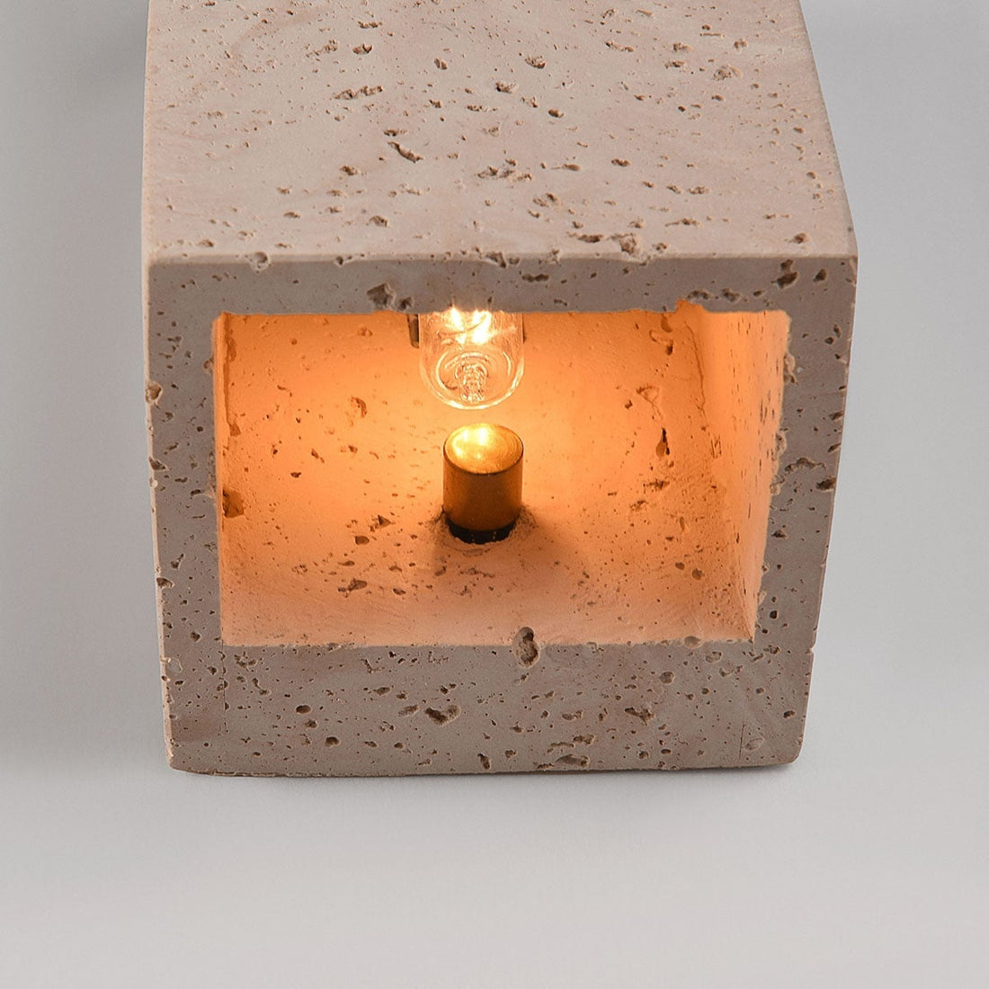 Cubo up down wall light illuminated showing warm light spread and shadow effect