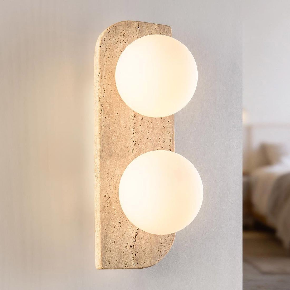 Orla travertine double globe wall light with glass spherical shades