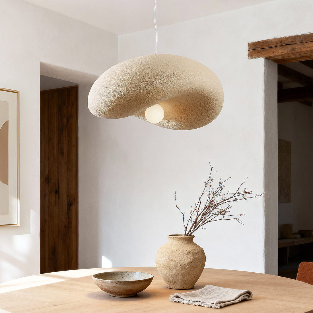 Kaia curved stone-effect pendant light in sand beige 60cm diameter hanging from ceiling