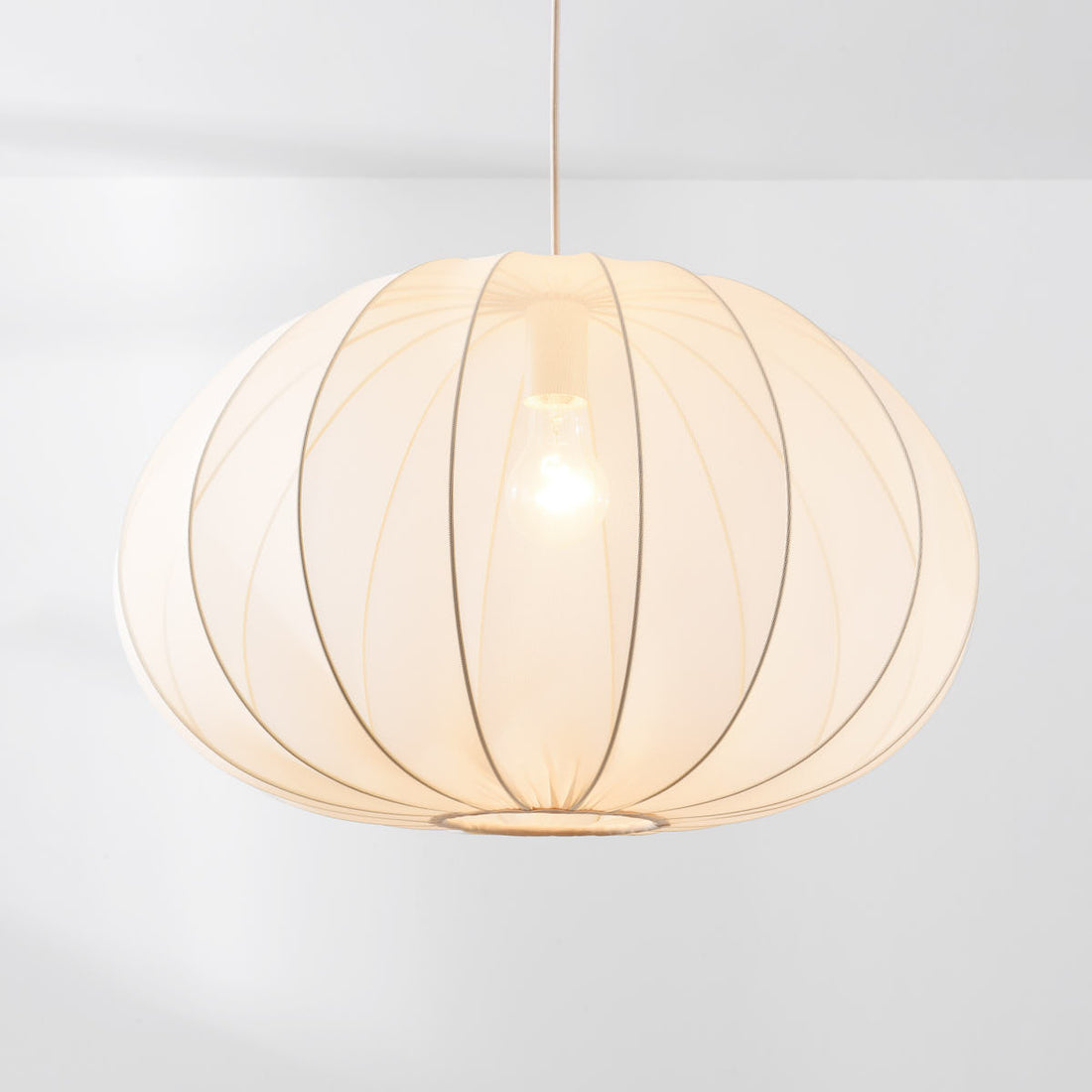 Odile 59cm beige pendant light in modern living room interior setting