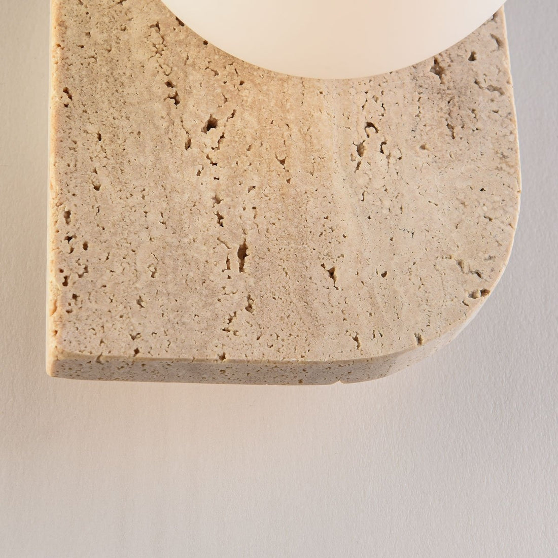 Orla single wall light glowing in modern interior setting showing warm ambient light