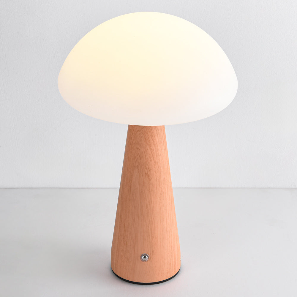 Poppi cordless mushroom lamp positioned on bedside table in modern bedroom