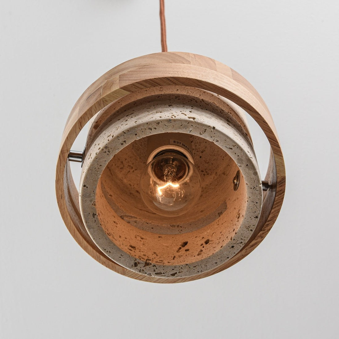Enju pendant light illuminated showing warm ambient glow from three suspended light cylinders