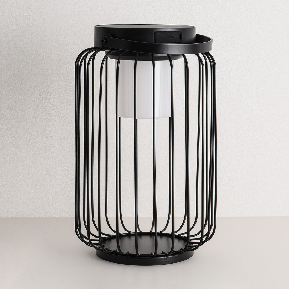 Black solar powered lantern with warm flickering light effect