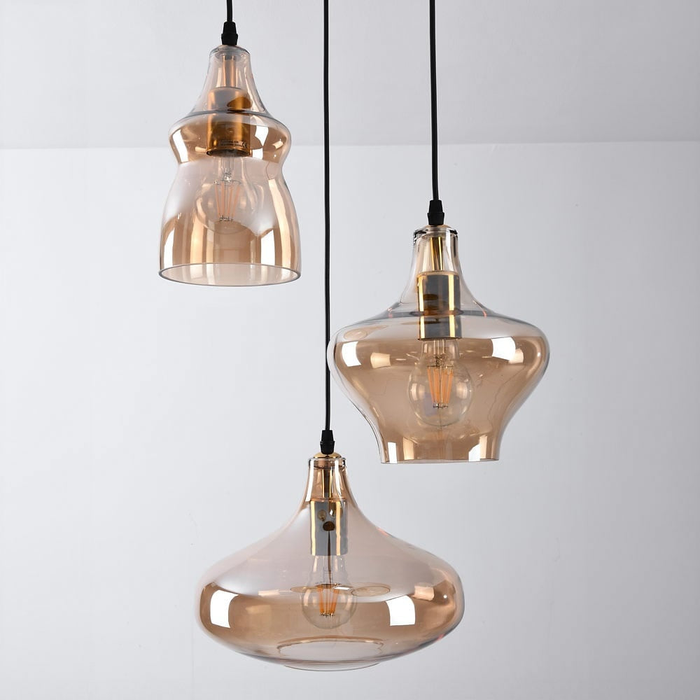 Close up of amber glass globe pendant light showing warm glow