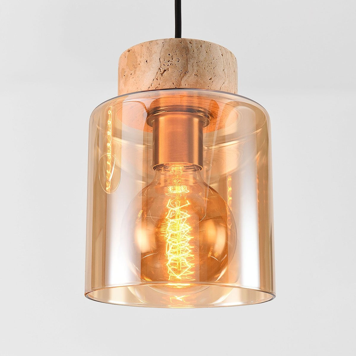 Akiko pendant light illuminated showing warm amber glow in dining room setting