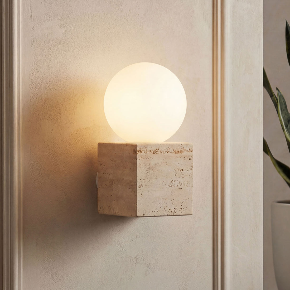 Isla sand beige travertine wall light with opal globe
