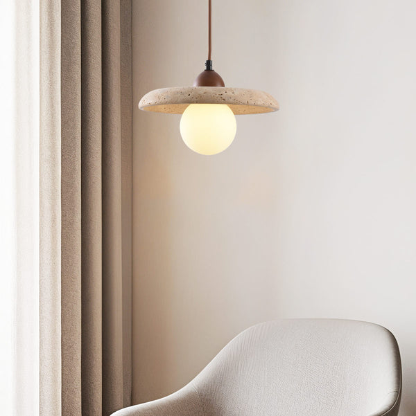 Kiyomi beige travertine and glass pendant light hanging over breakfast bar