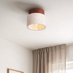 Close up view of Tavira ceiling light showing natural stone texture and dark wood frame