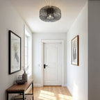Industrial cage pendant light in black finish hanging from ceiling