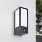 Lyon outdoor wall light with motion sensor illuminated at night on house exterior