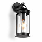 Alicia matt black industrial outdoor wall lantern with clear glass and filament bulb, angled view