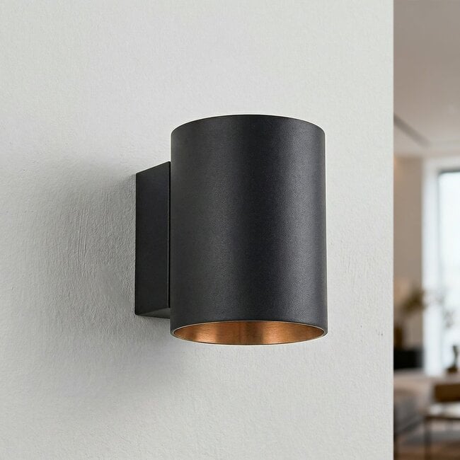 Close up detail of Jen round wall light black exterior and gold accent