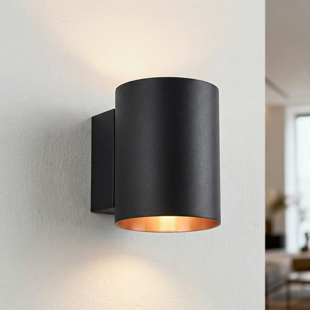 Jen modern round wall light in black with gold inner finish