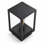 Sem glass panel post lantern in black, angled view of the cube frame and filament bulb